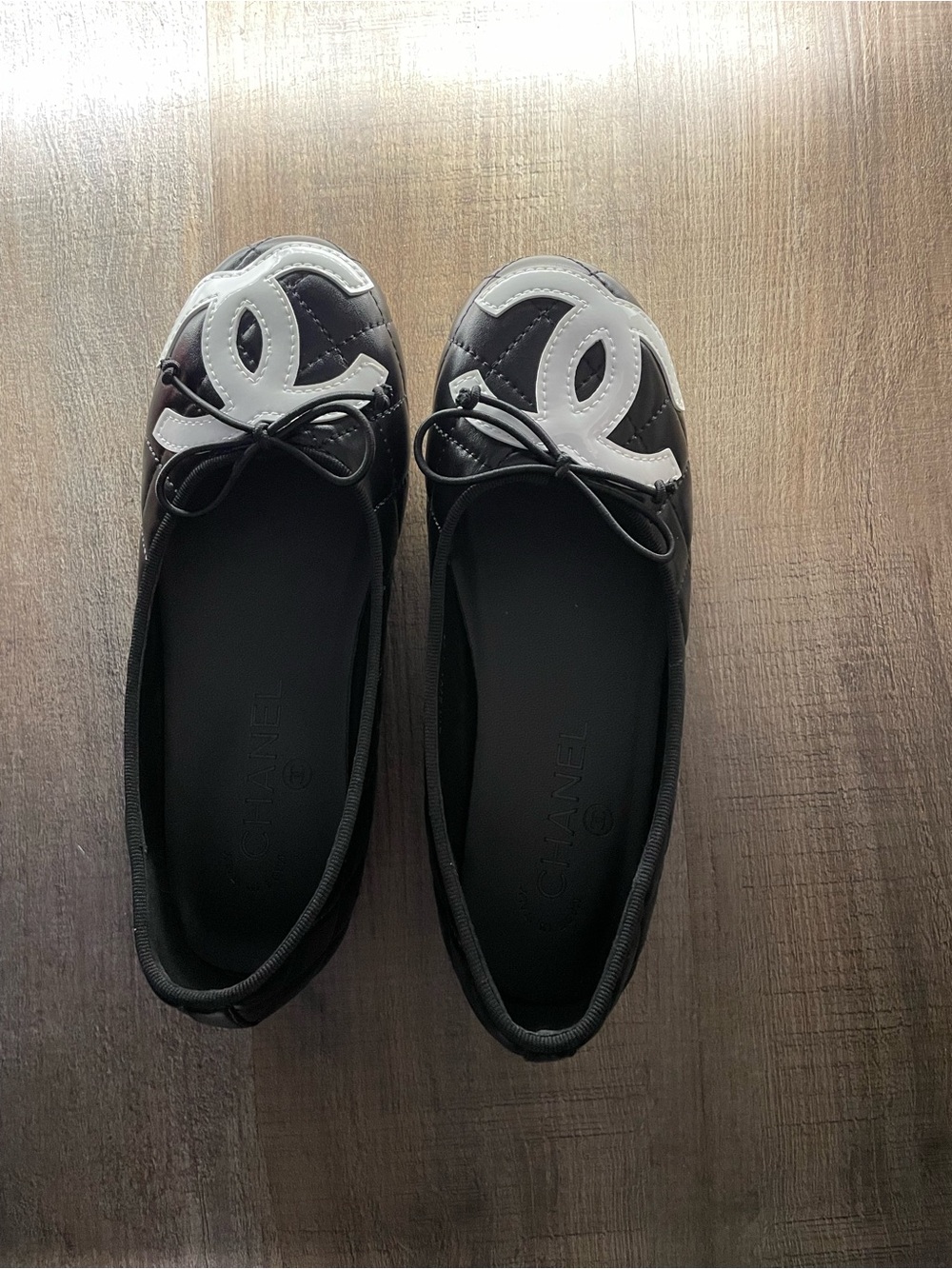 CHANEL Black and White Quilted Logo Cap-Toe Ballet Flats